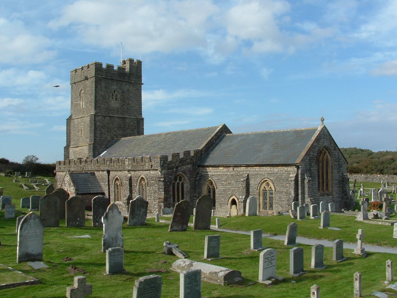 A cemetery with a church in the background