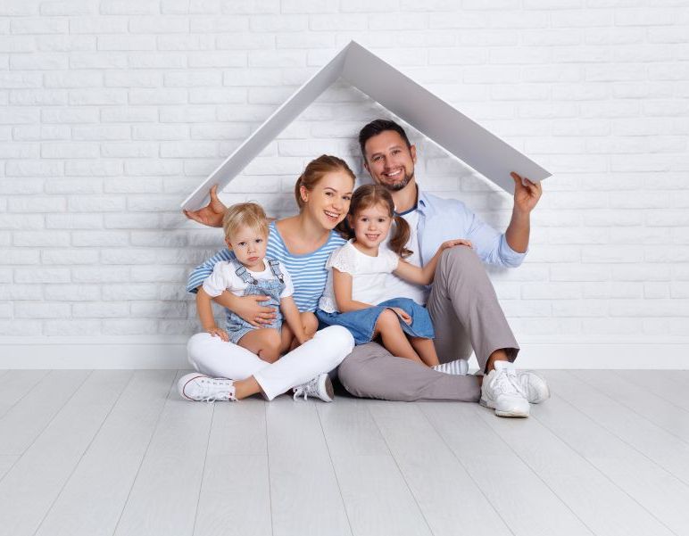 broker presenting the house model to the customer