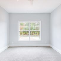 There is a large window in the middle of the room.