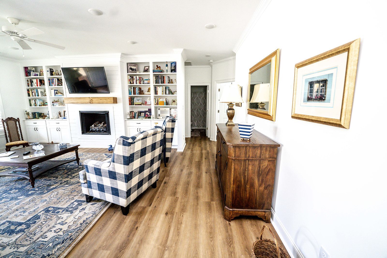 A living room filled with furniture and a fireplace.
