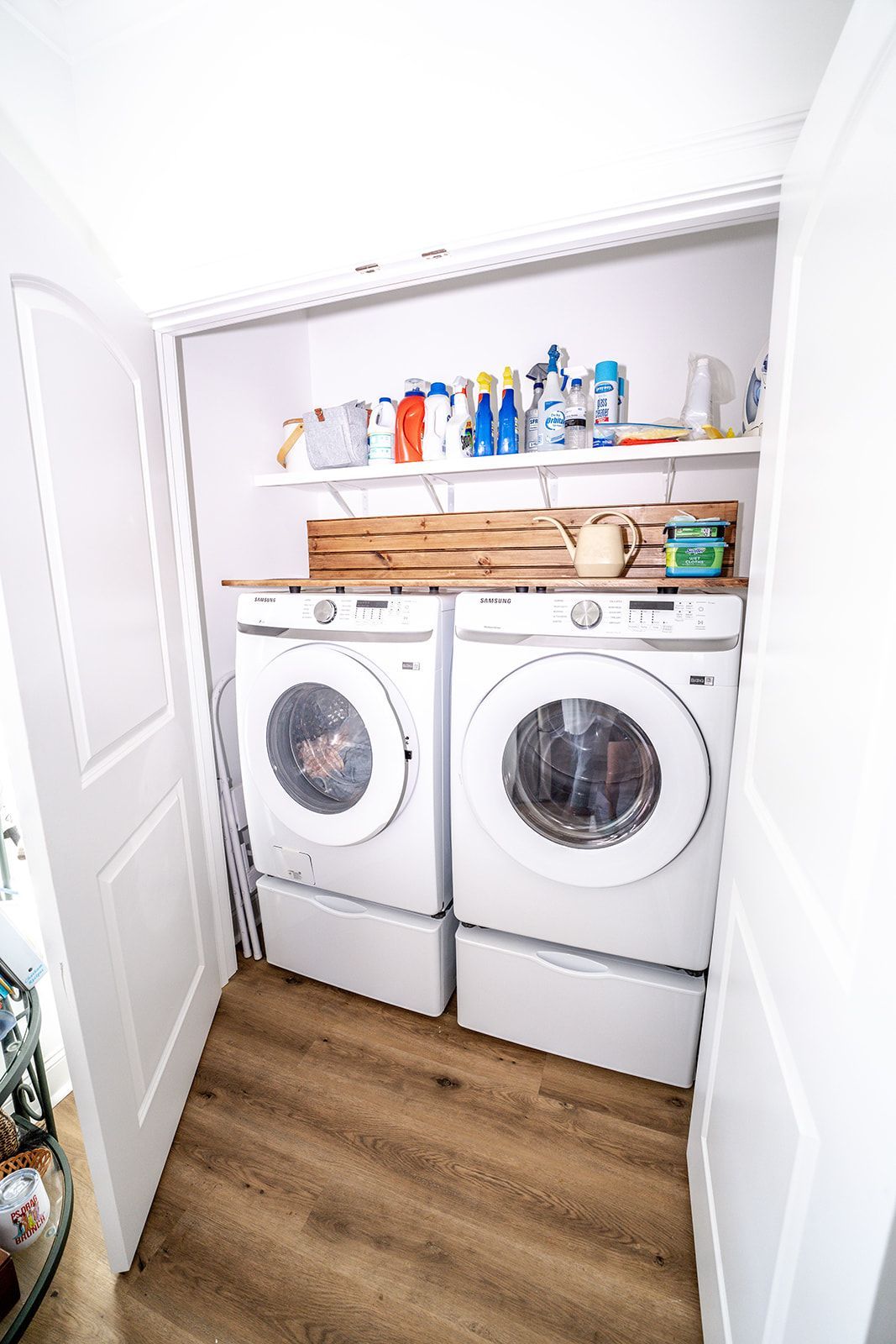 A laundry room with a washer and dryer in a closet.