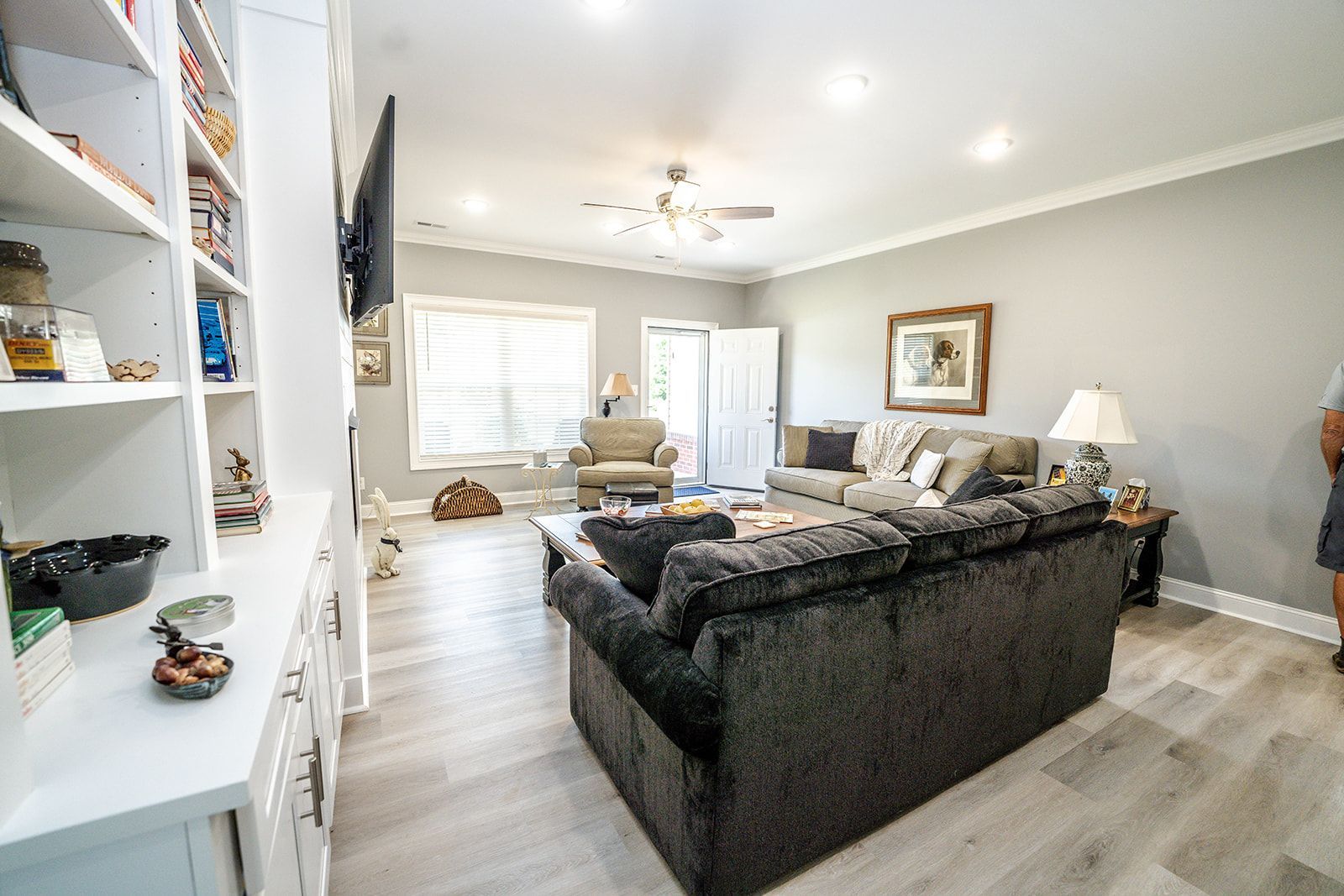 A living room filled with furniture and a flat screen tv.