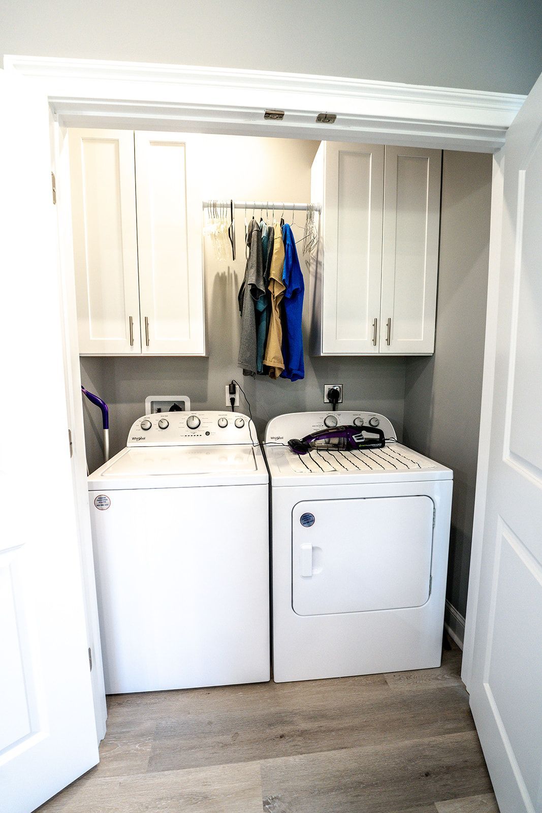A laundry room with a washer and dryer in it.