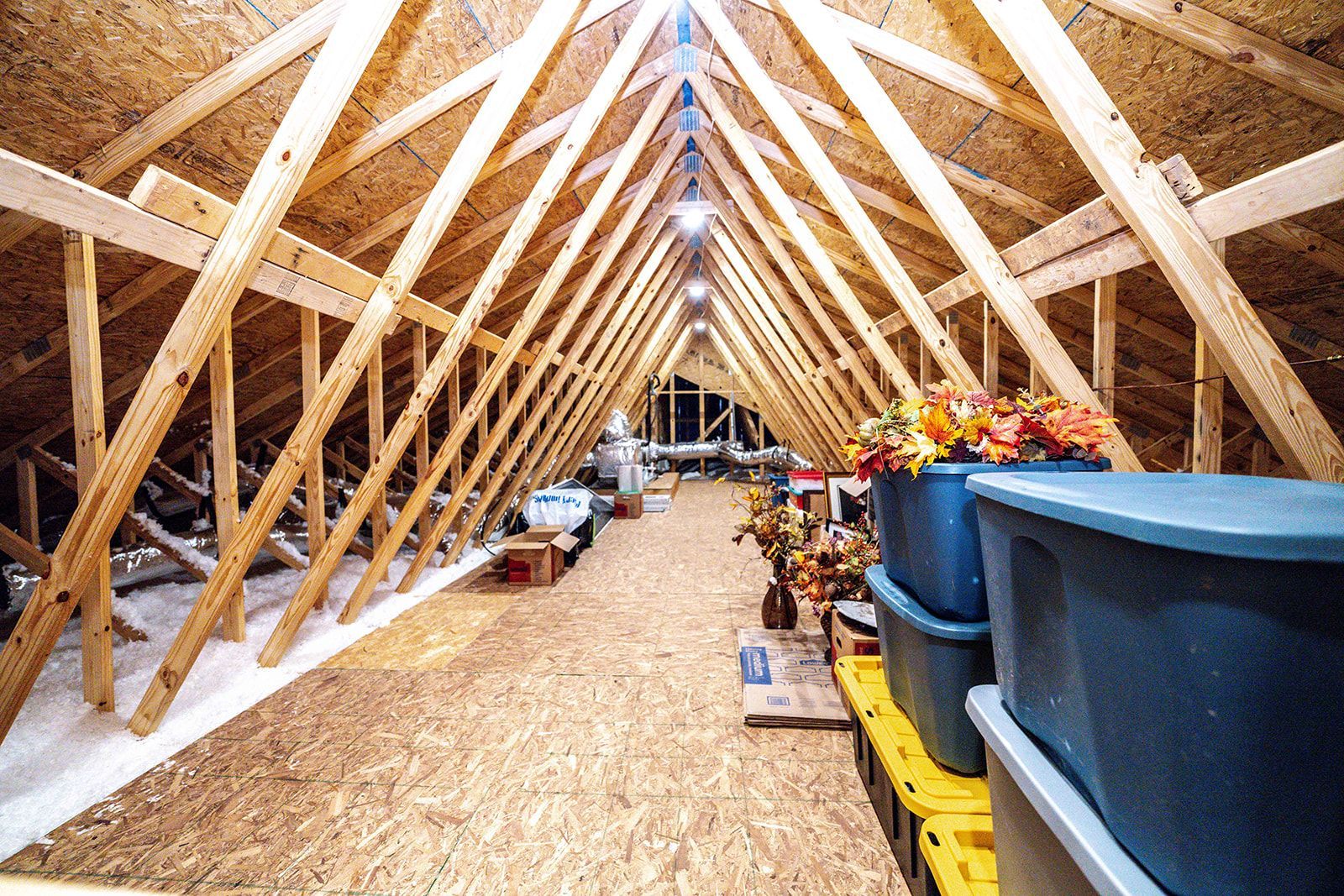 An attic filled with lots of boxes and flowers