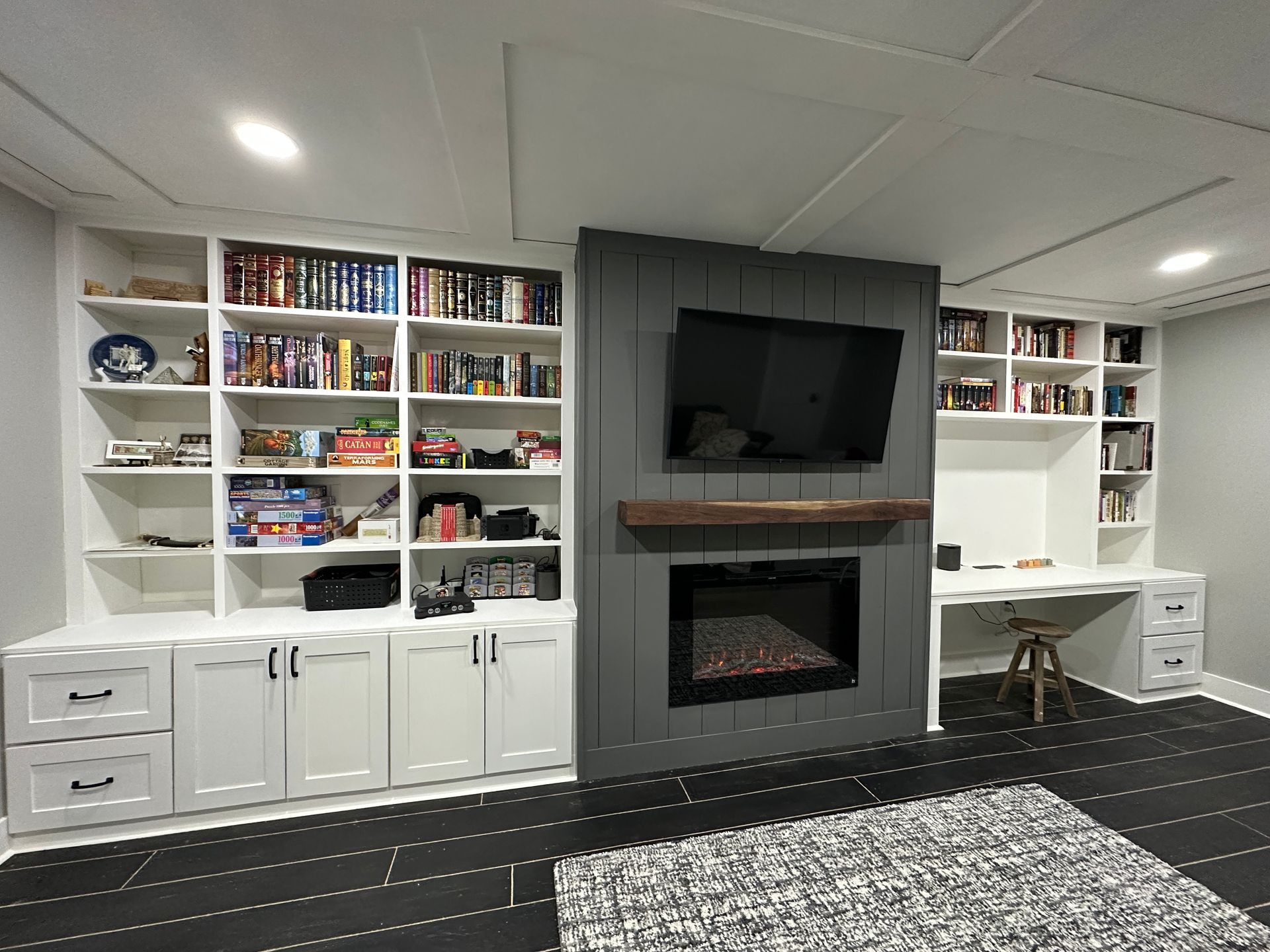 There is a fireplace in the middle of the room.