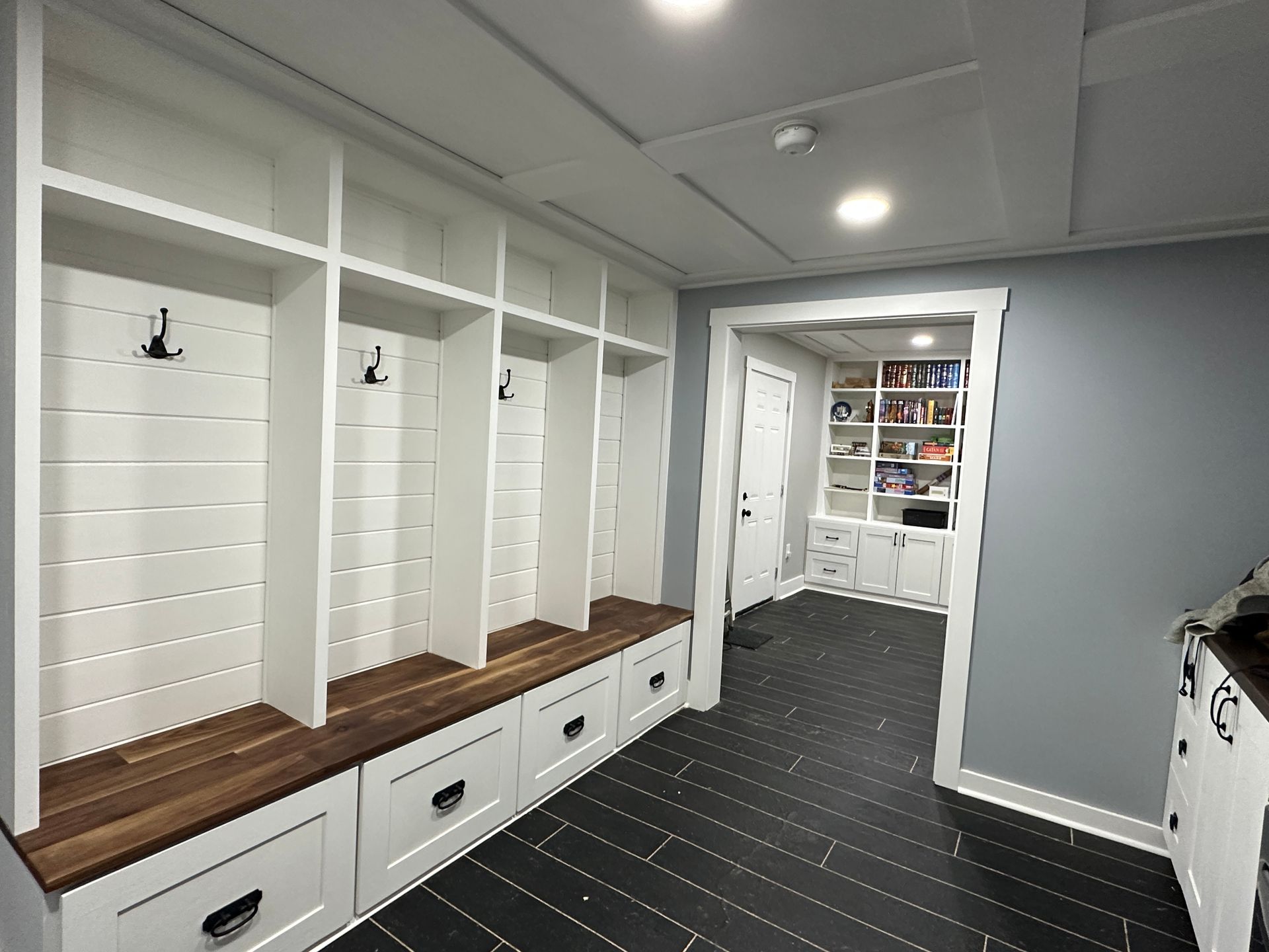 A room with a lot of shelves and drawers in it