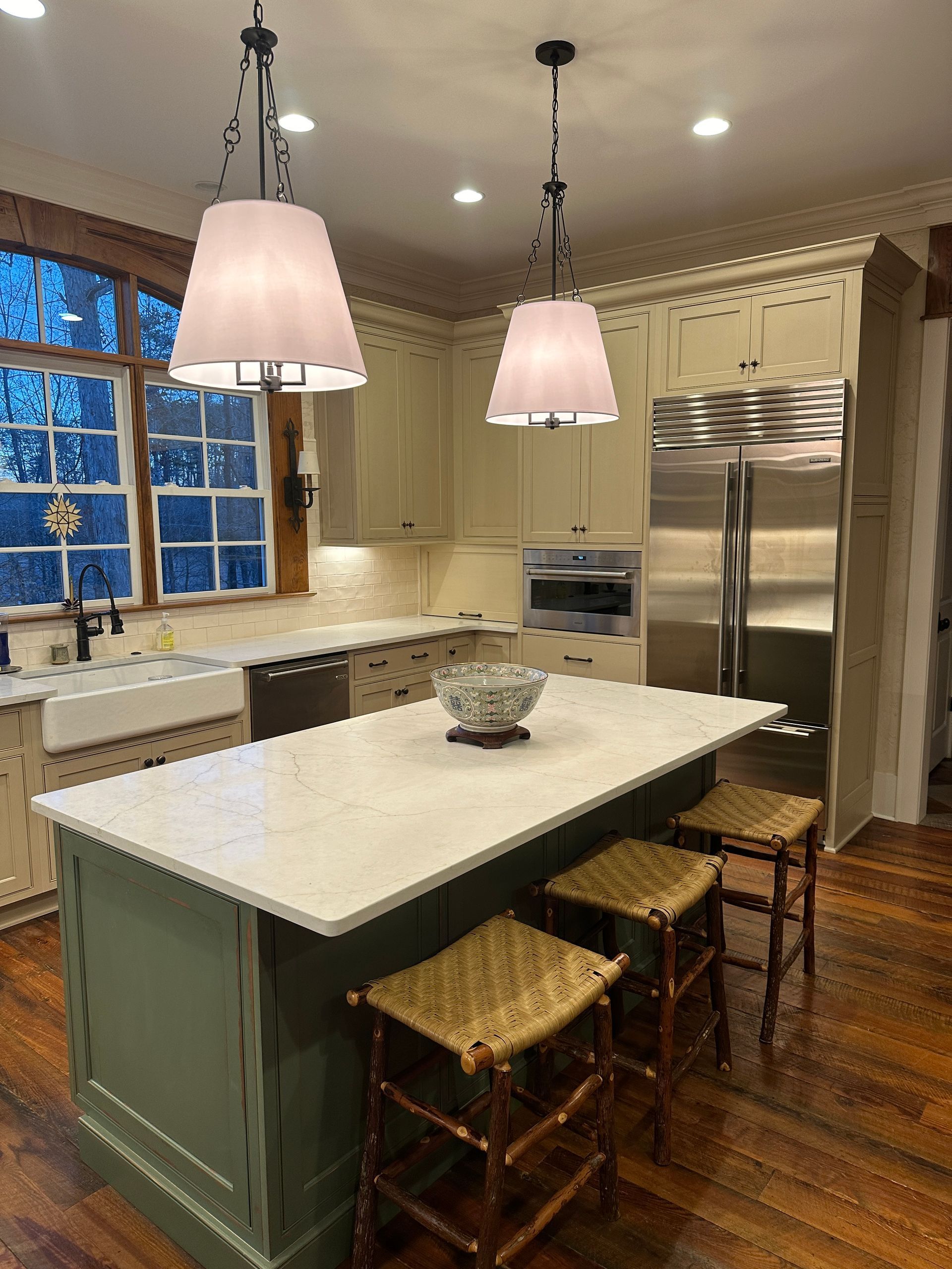 There is a large island in the middle of the kitchen.
