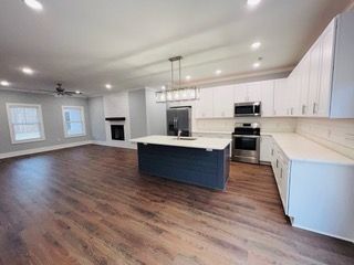 There is a large island in the middle of the kitchen.