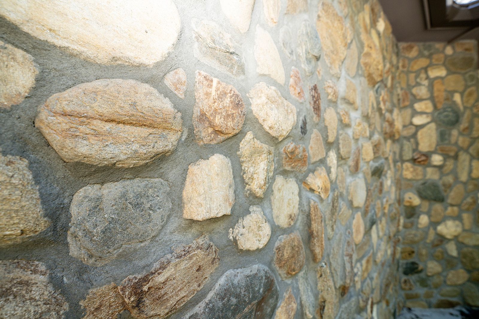 A stone wall with a lot of rocks on it