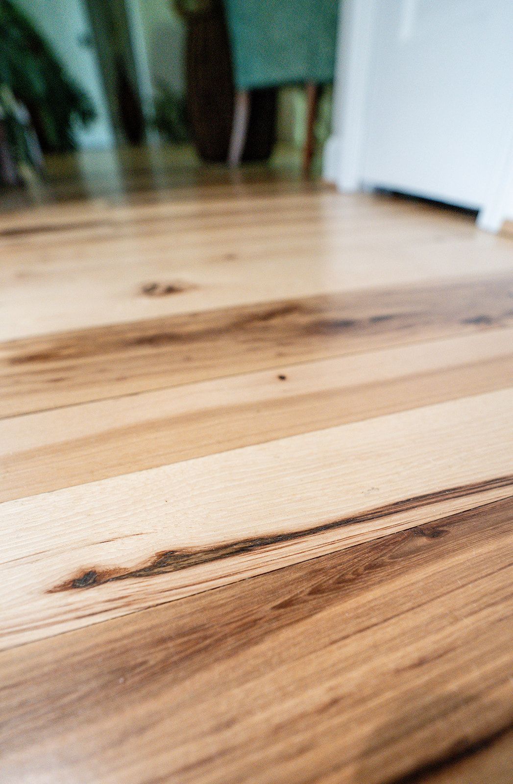 A close up of a wooden floor in a living room.