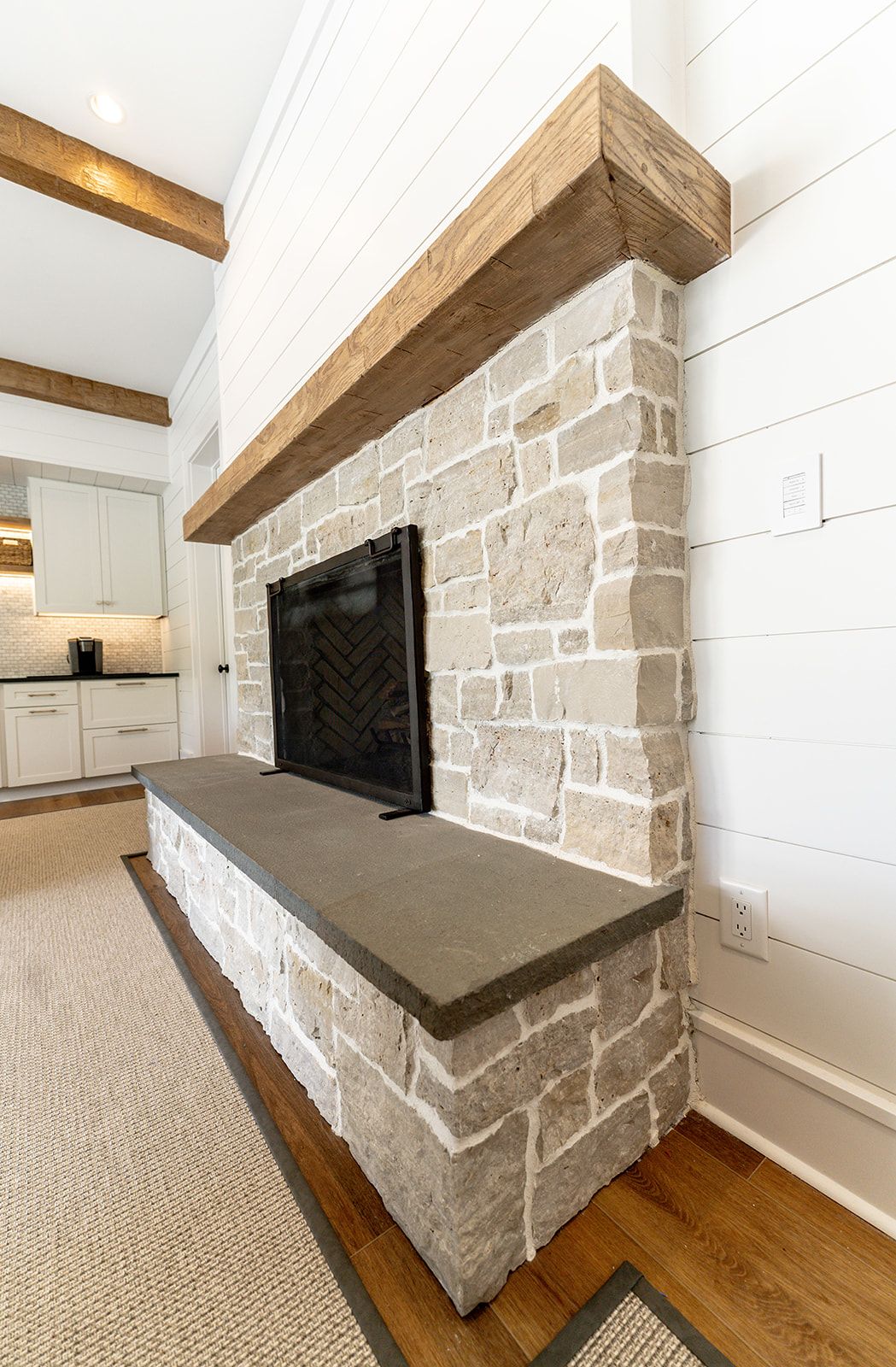 There is a fireplace in the middle of the room.