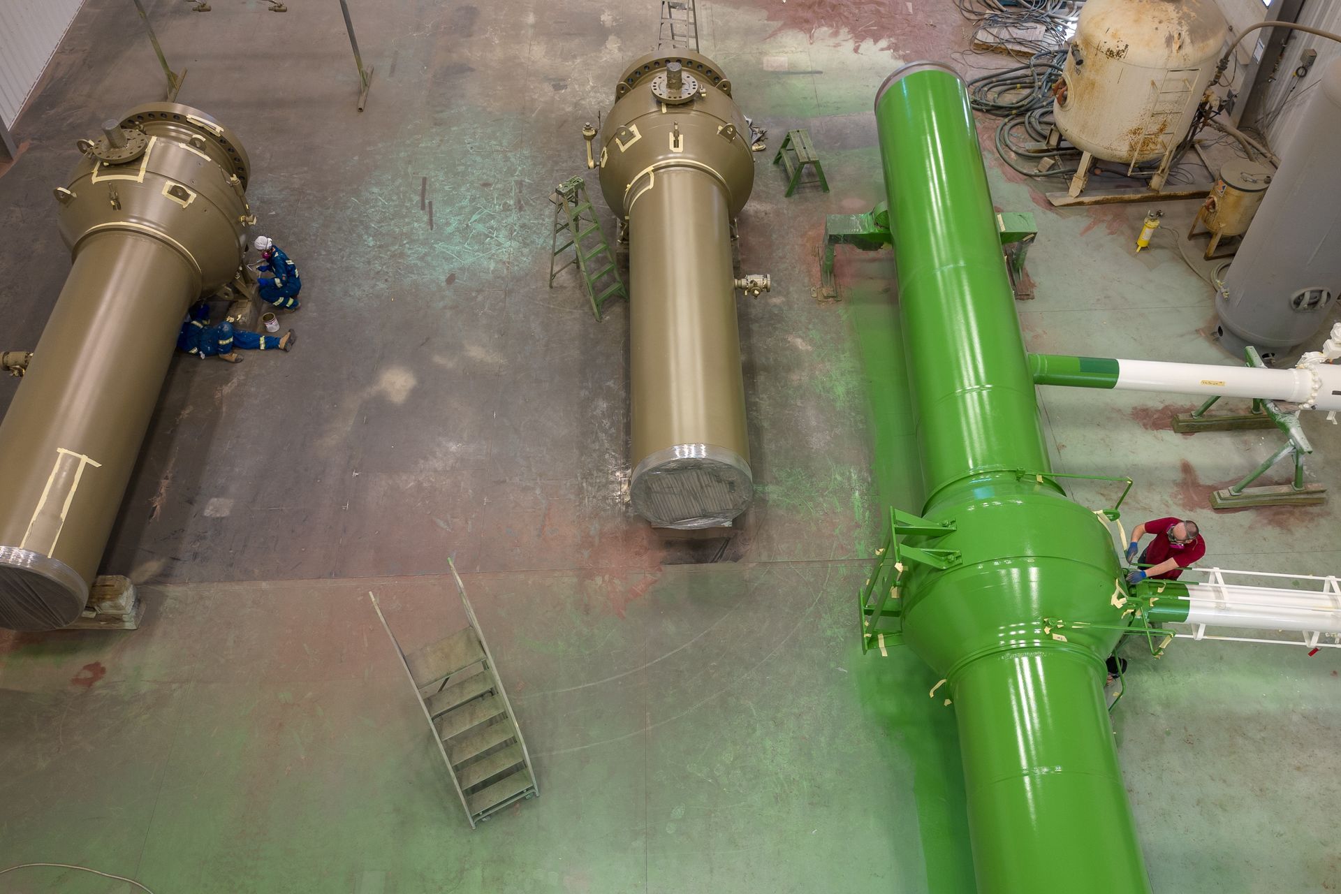 Multiple blast-cleaned and coated components laid out for final inspection