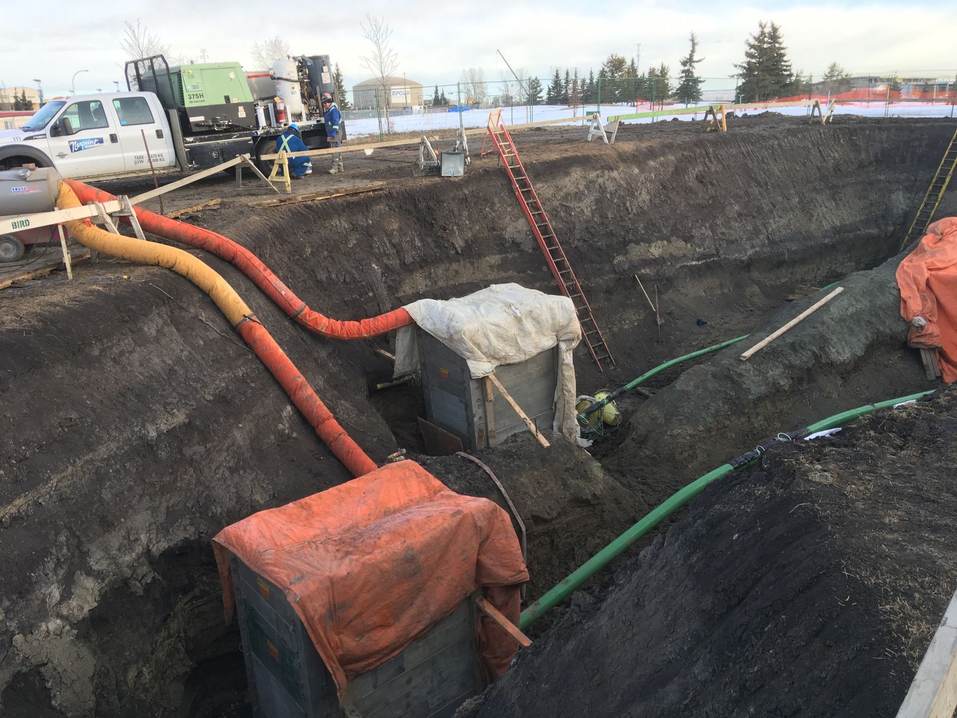 Underground coating work in progress on large-scale industrial pipeline project