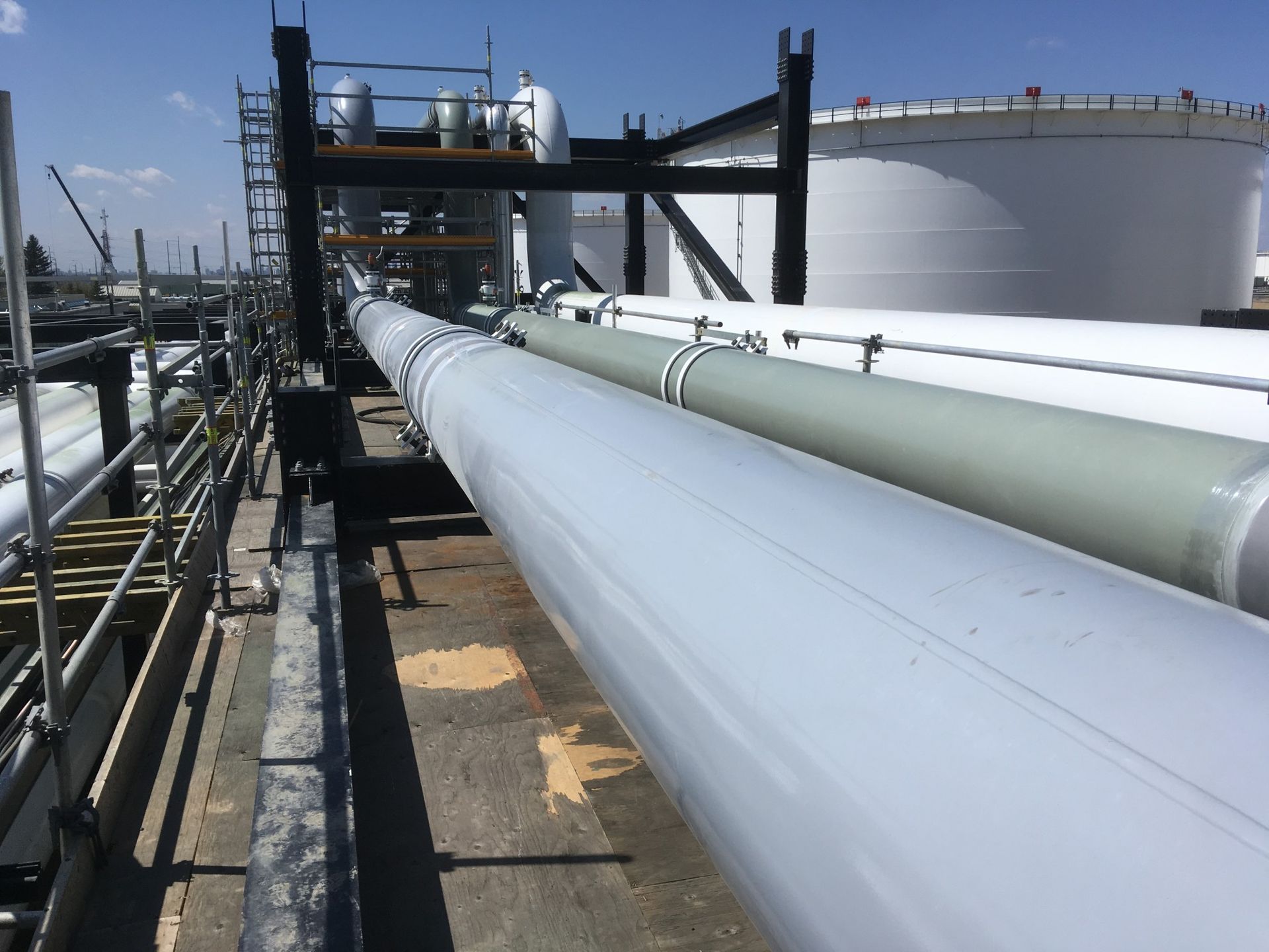 Newly coated above-ground pipeline system at an industrial facility