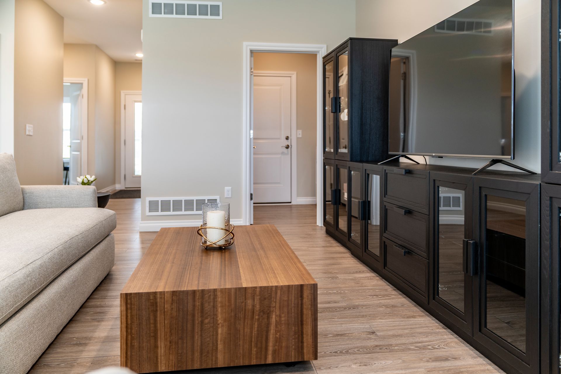 Photo of a coffee table in between a couch and an entertainment center