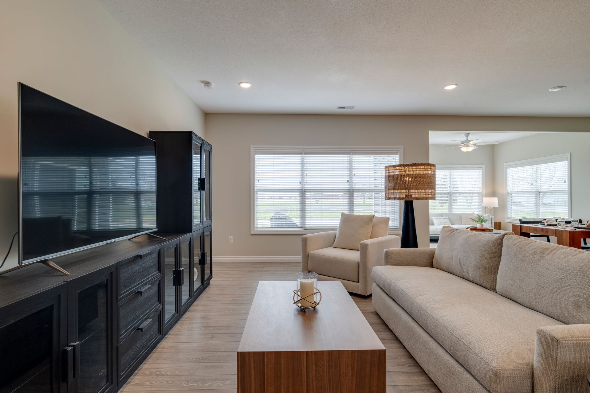 Photo of a living room, showing furniture in front of an entertainment center