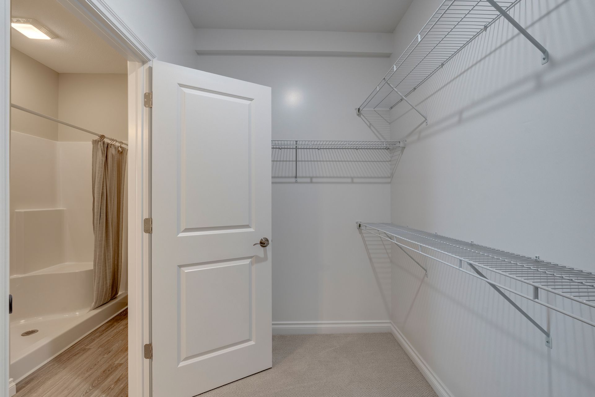 Photo of a walk-in closet with plenty of space and shelving