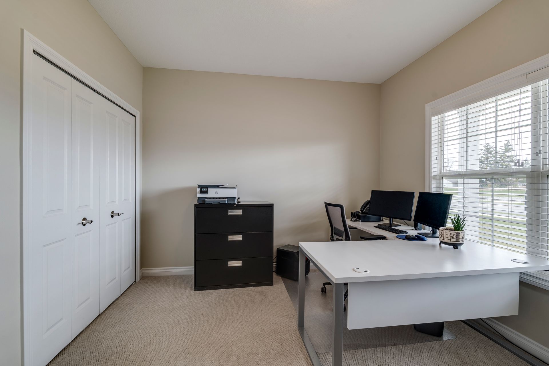 Photo of an office large enough to hold a wrap-around desk