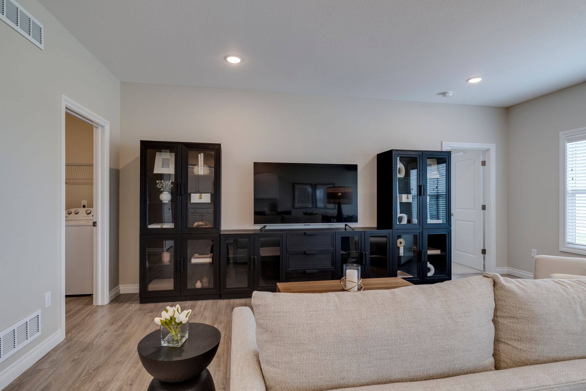 Photo of an entertainment center behind a couch
