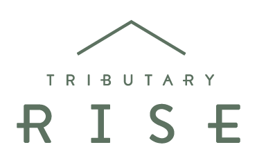 Logo for "Tributary Rise": Green text and roofline over "RISE".