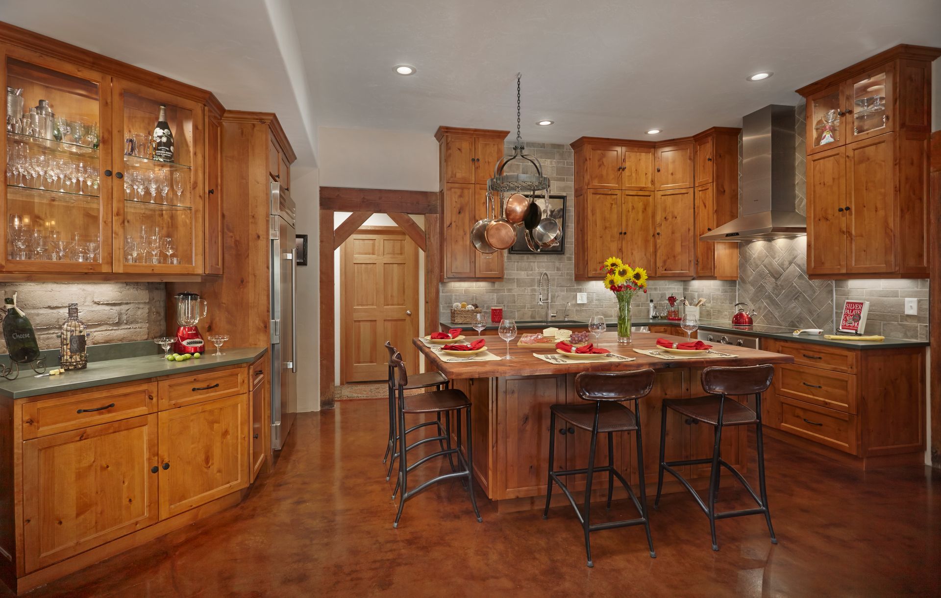 A kitchen with wooden cabinets and stainless steel appliances