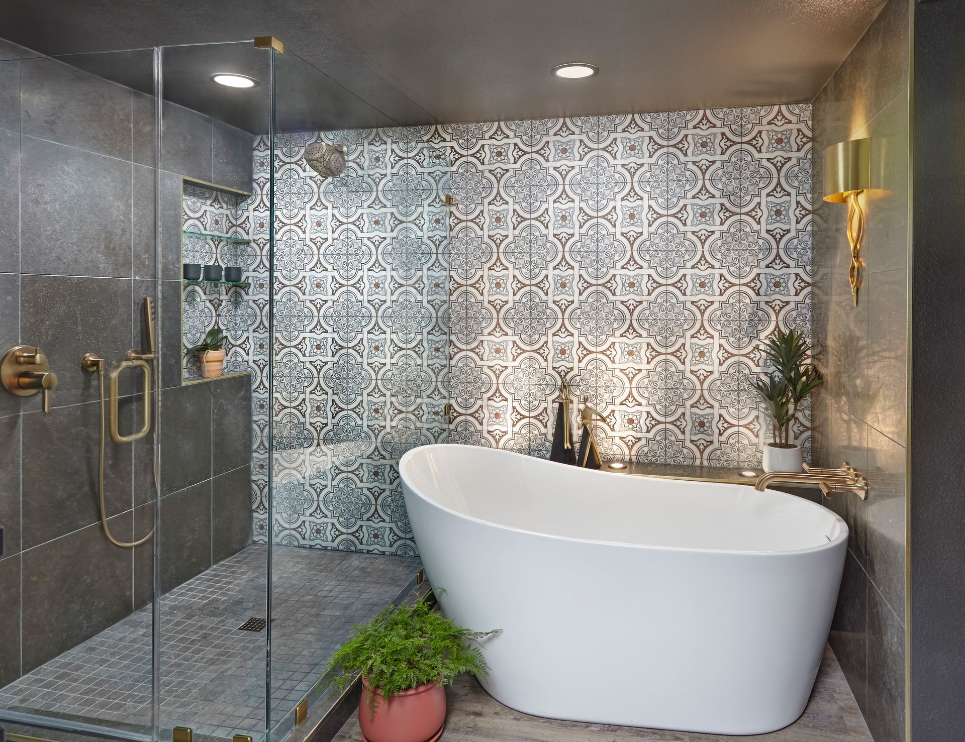 A bathroom with a bathtub and a walk in shower.