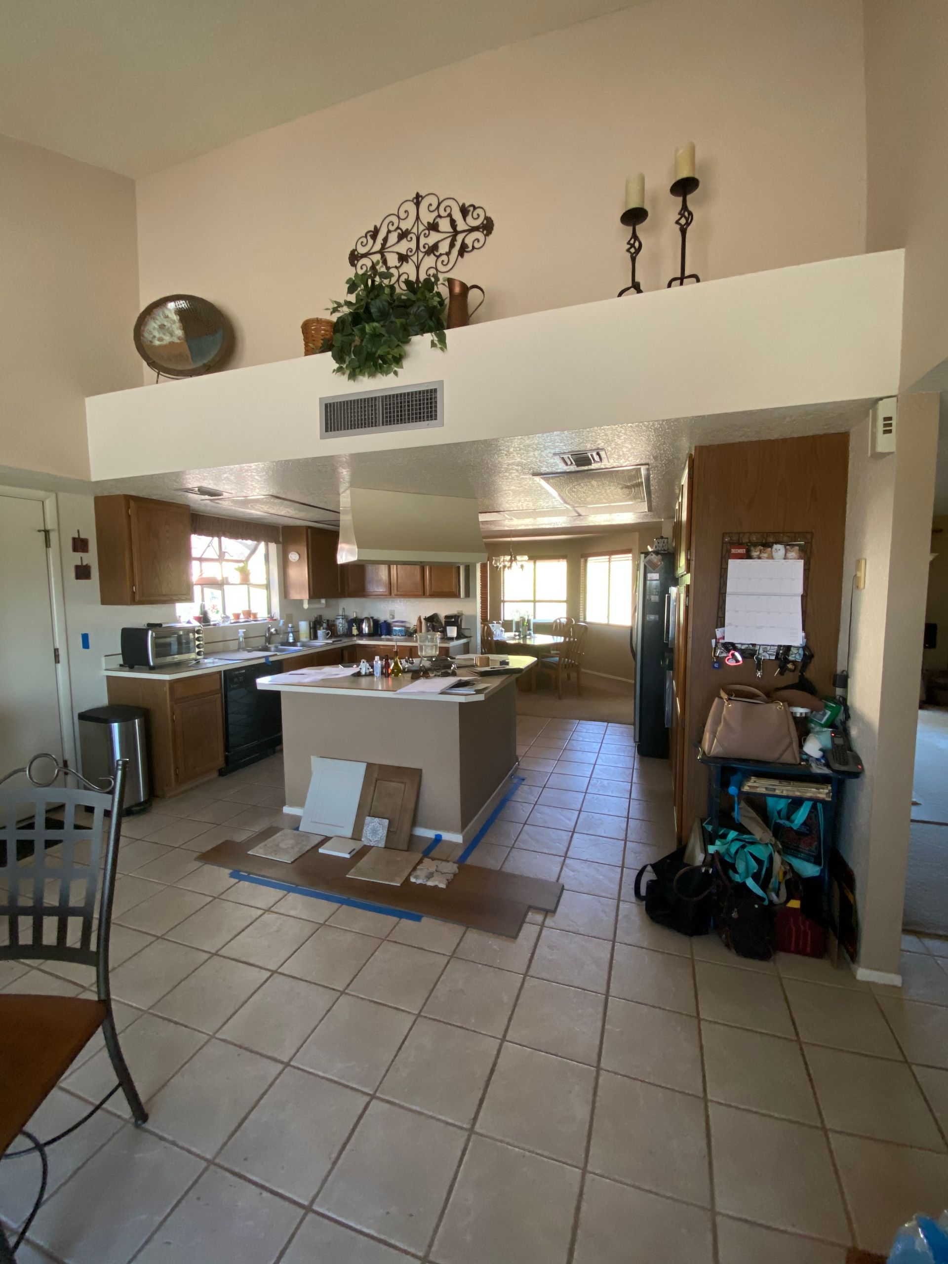 A kitchen with a large island in the middle of the room.
