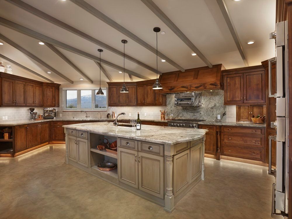 A large kitchen with a large island in the middle