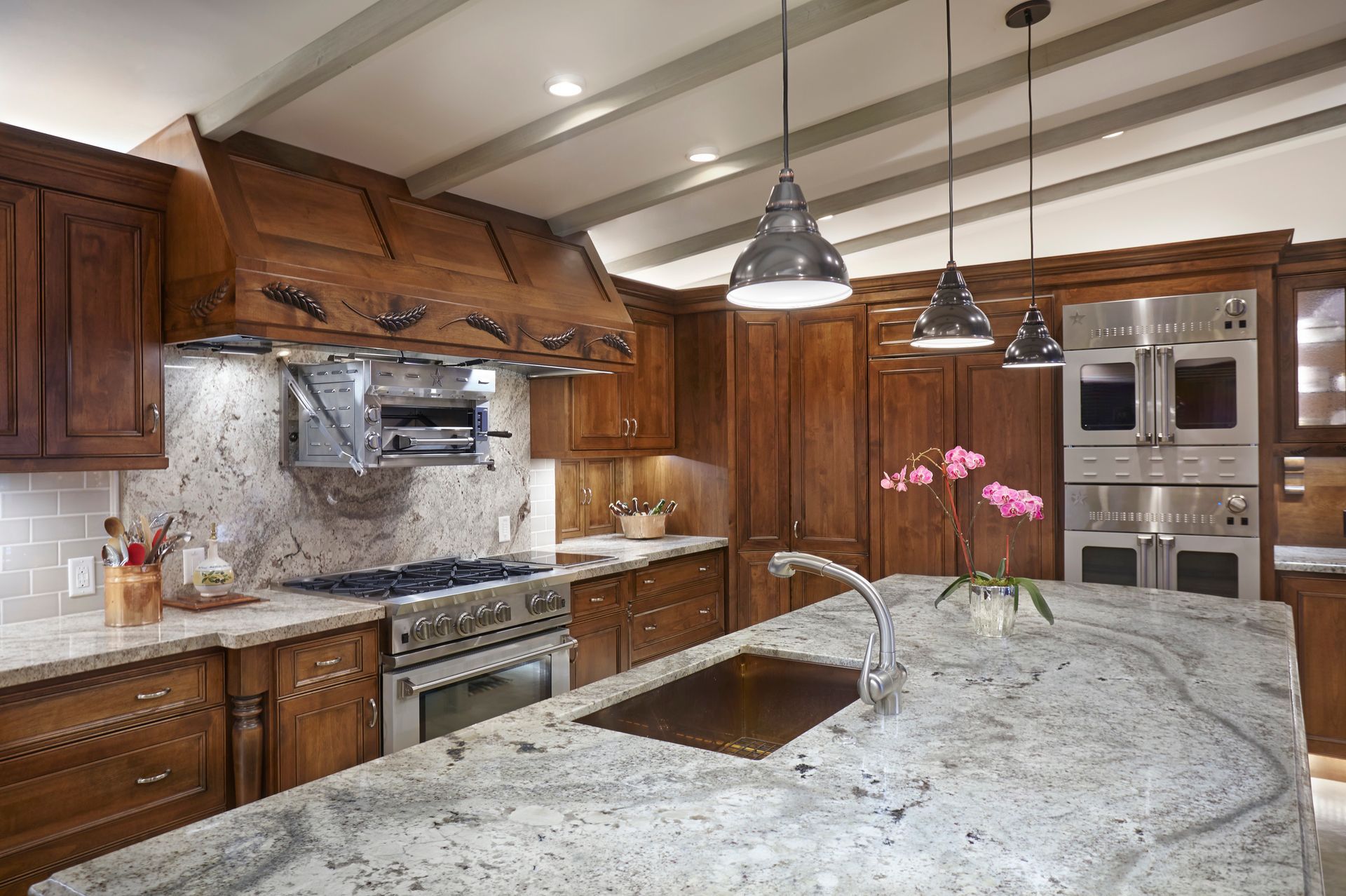 Kitchen with wood cabinets, granite countertops, and stainless steel appliances.