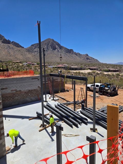 A construction site with a mountain in the background