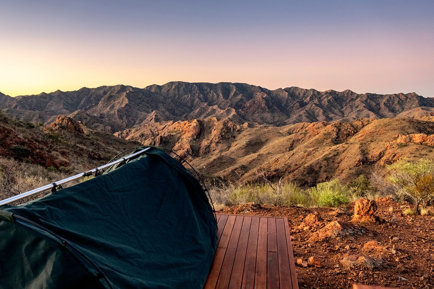 Sunset view of the rugged mountain ranges at Arkaroola, from the Ridgetop Sleepout, offering a serene and immersive camping experience in the Australian outback. Experience this on the Arkaroola Photography Tour.