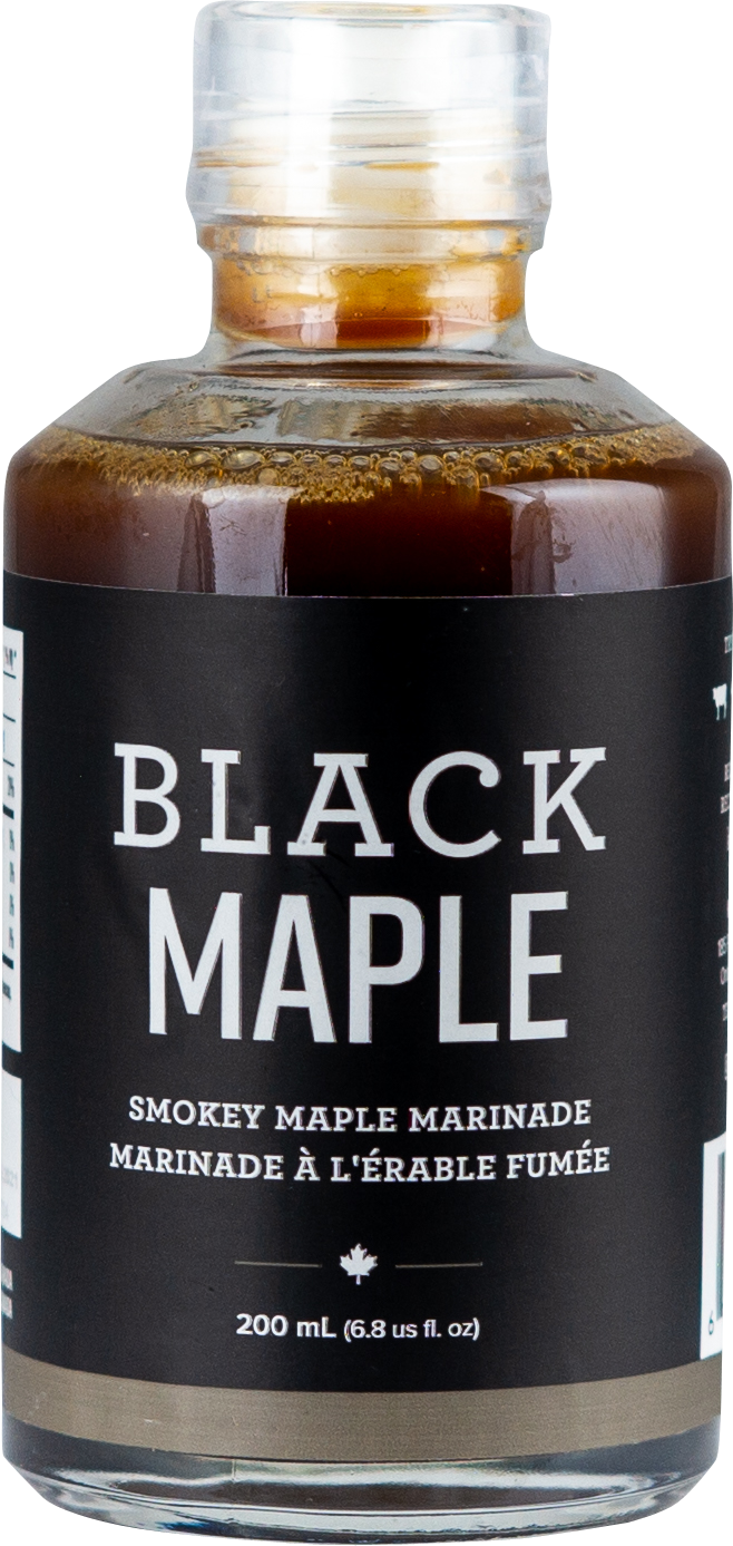 A bottle of black maple syrup with a clear cap