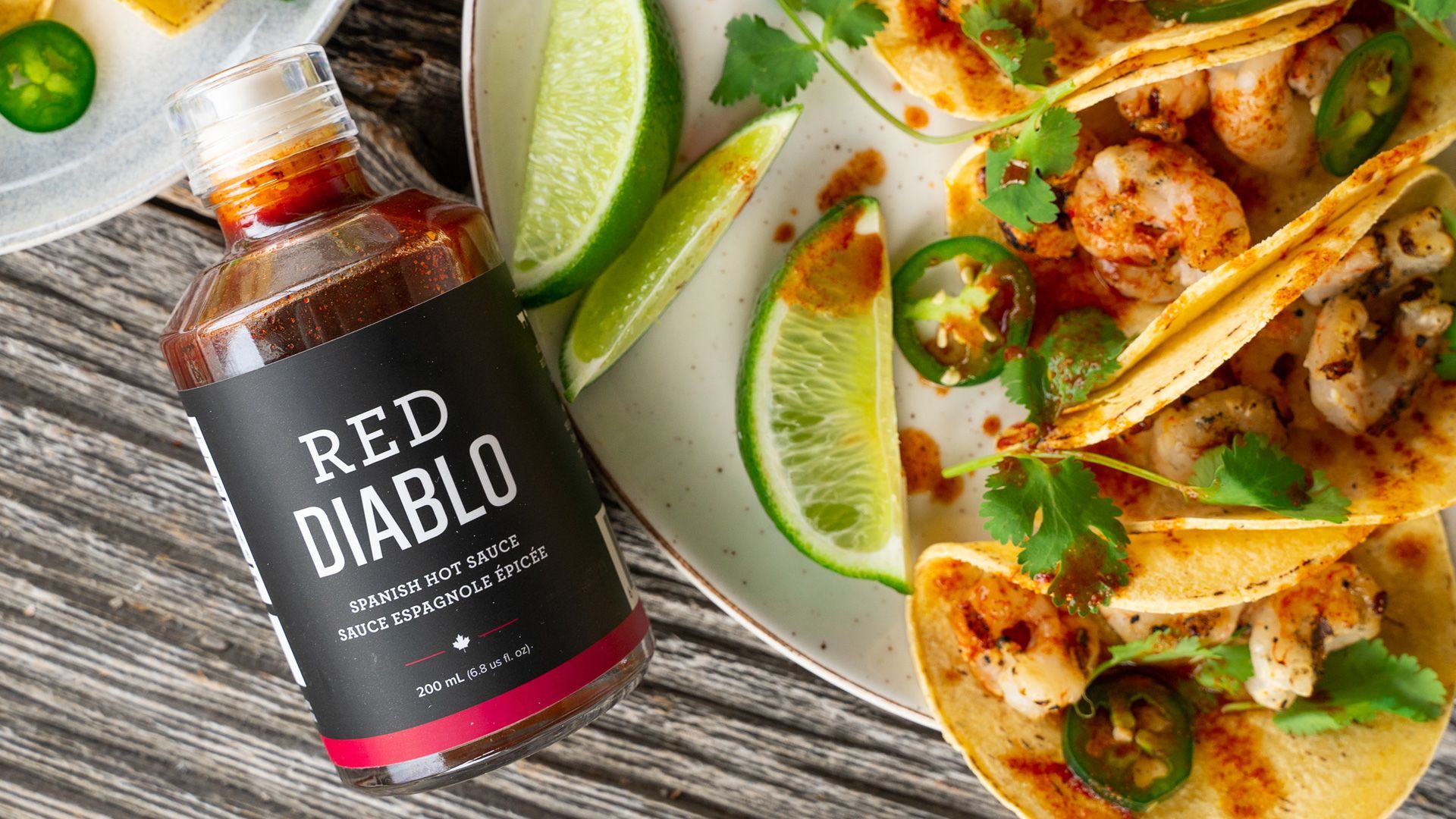 A hamburger is sitting on a piece of paper next to french fries