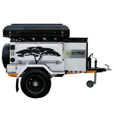 A white trailer with a tree on it and the word camp on it