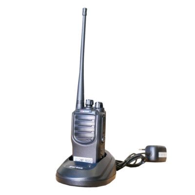 A walkie talkie with a charger attached to it