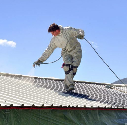 Man Respraying the Roof — Roofers in Bonogin QLD