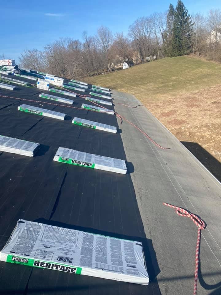 A roof with a lot of roofing materials on it.