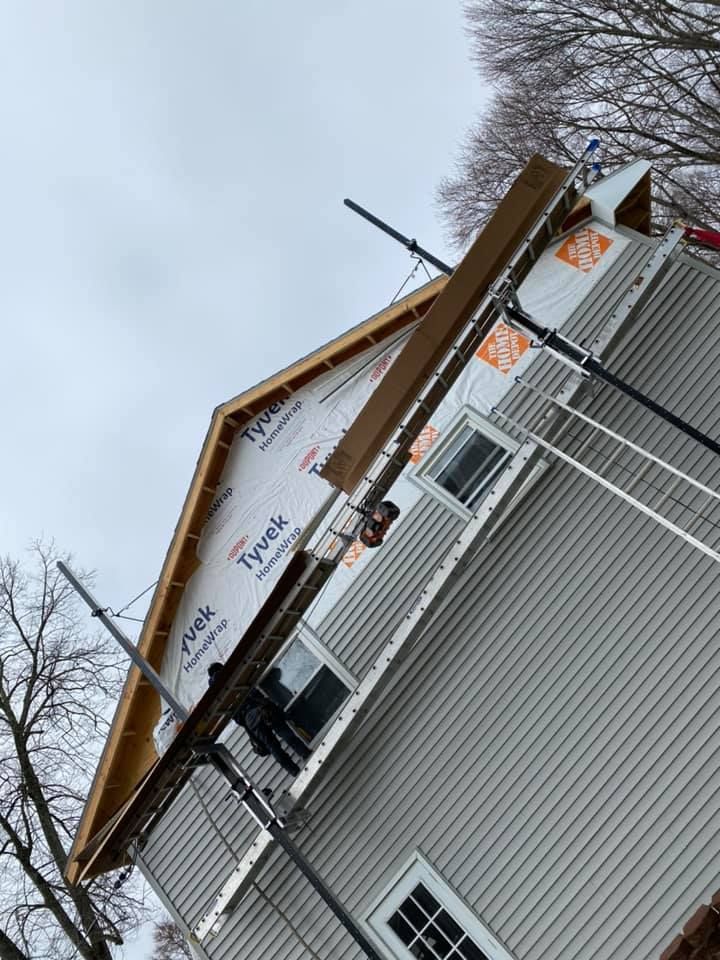 A house is being remodeled with a roof that is covered in styrofoam.