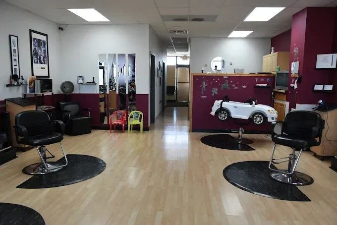 A hair salon with a toy car on the wall