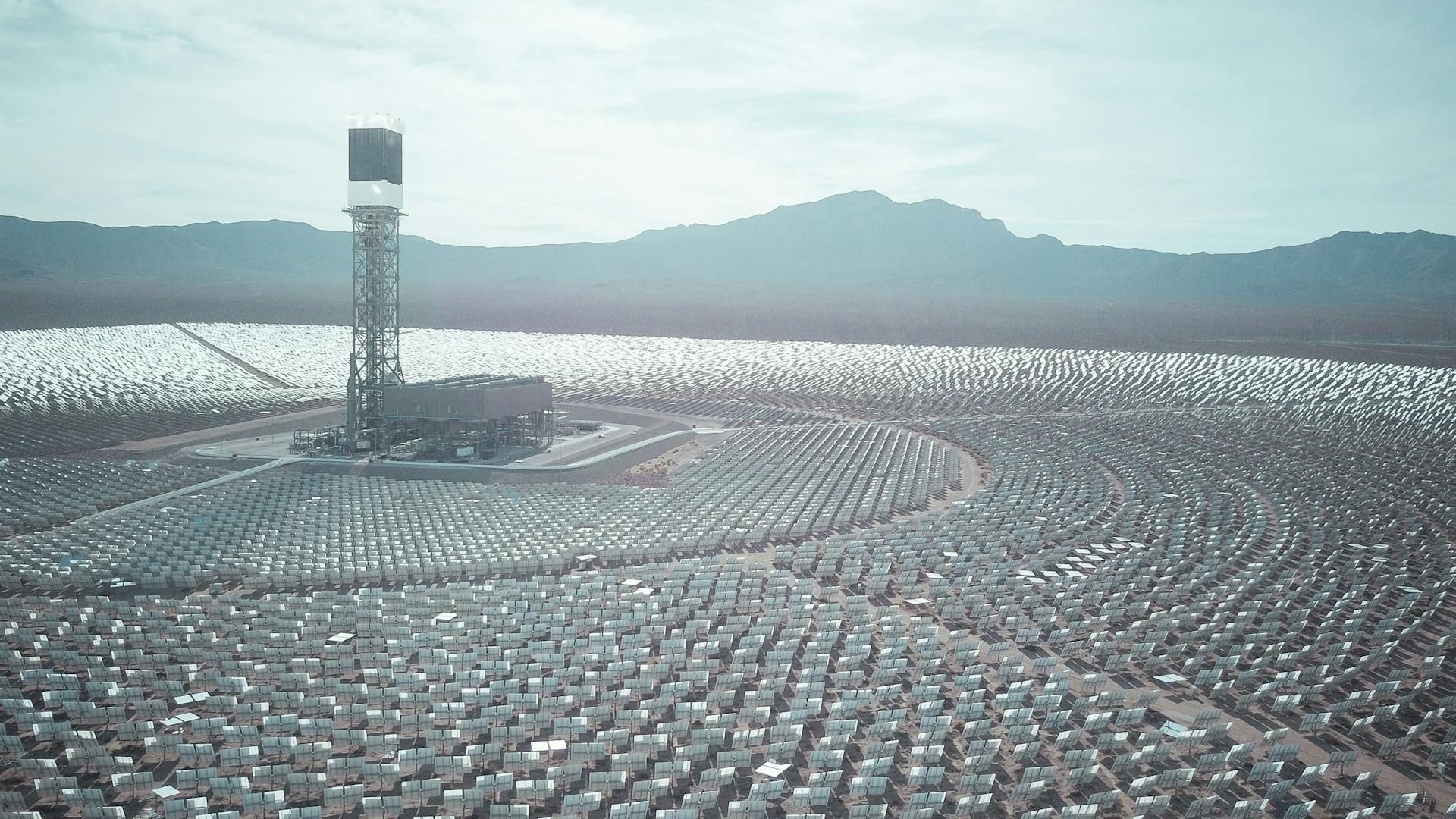 A solar energy farm organized in concentric circles with a tower at the center.