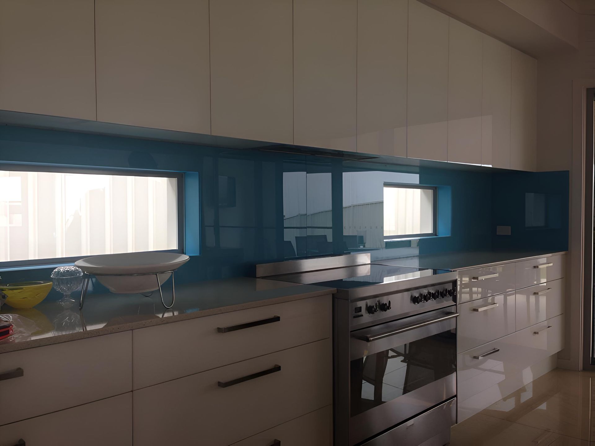 A Kitchen With White Cabinets And Blue Counter Tops — Pavy's Glass In Port Macquarie, NSW