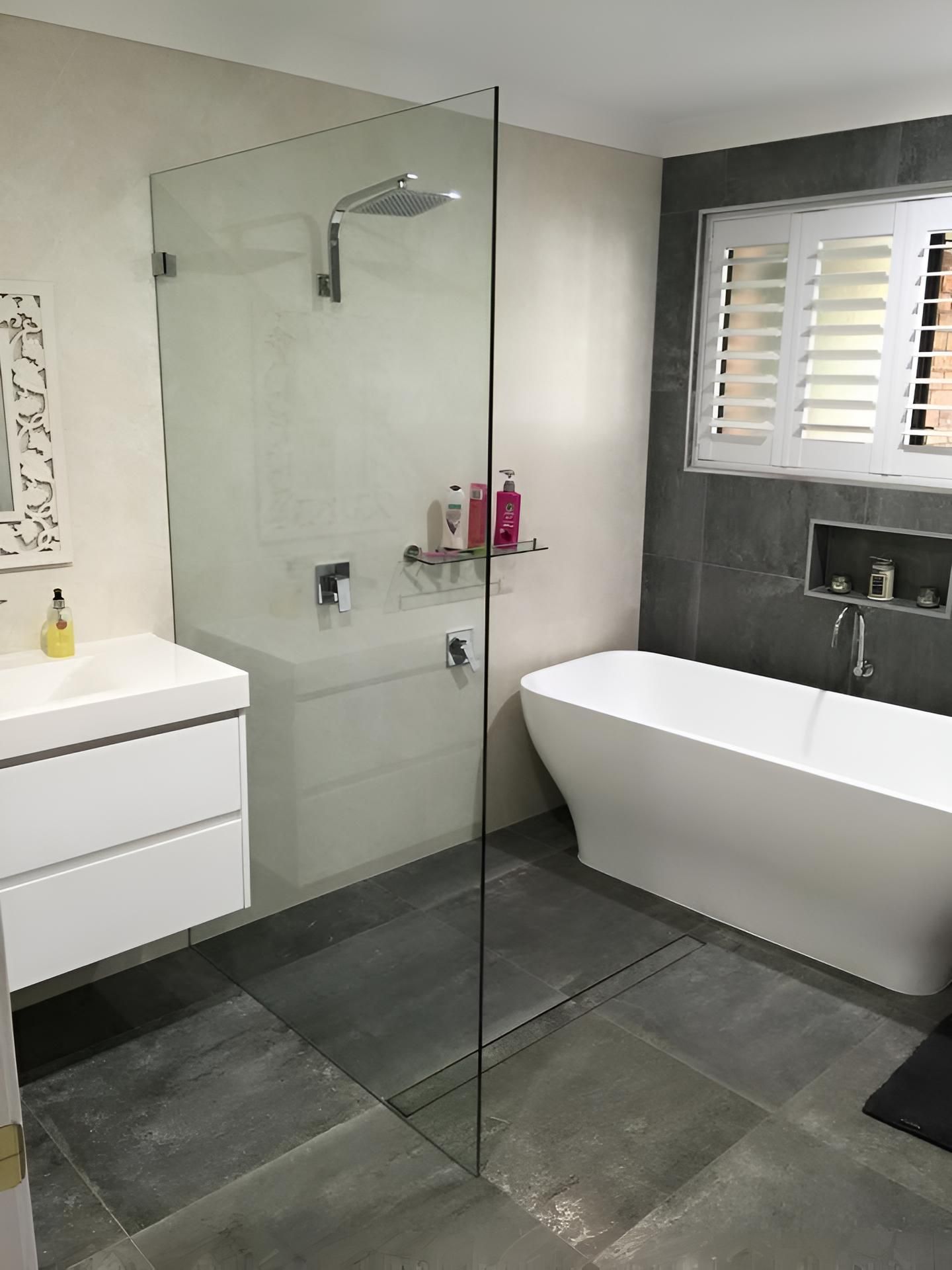 A Bathroom With A Walk In Shower, Bathtub, Sink And Window — Pavy's Glass In Port Macquarie, NSW