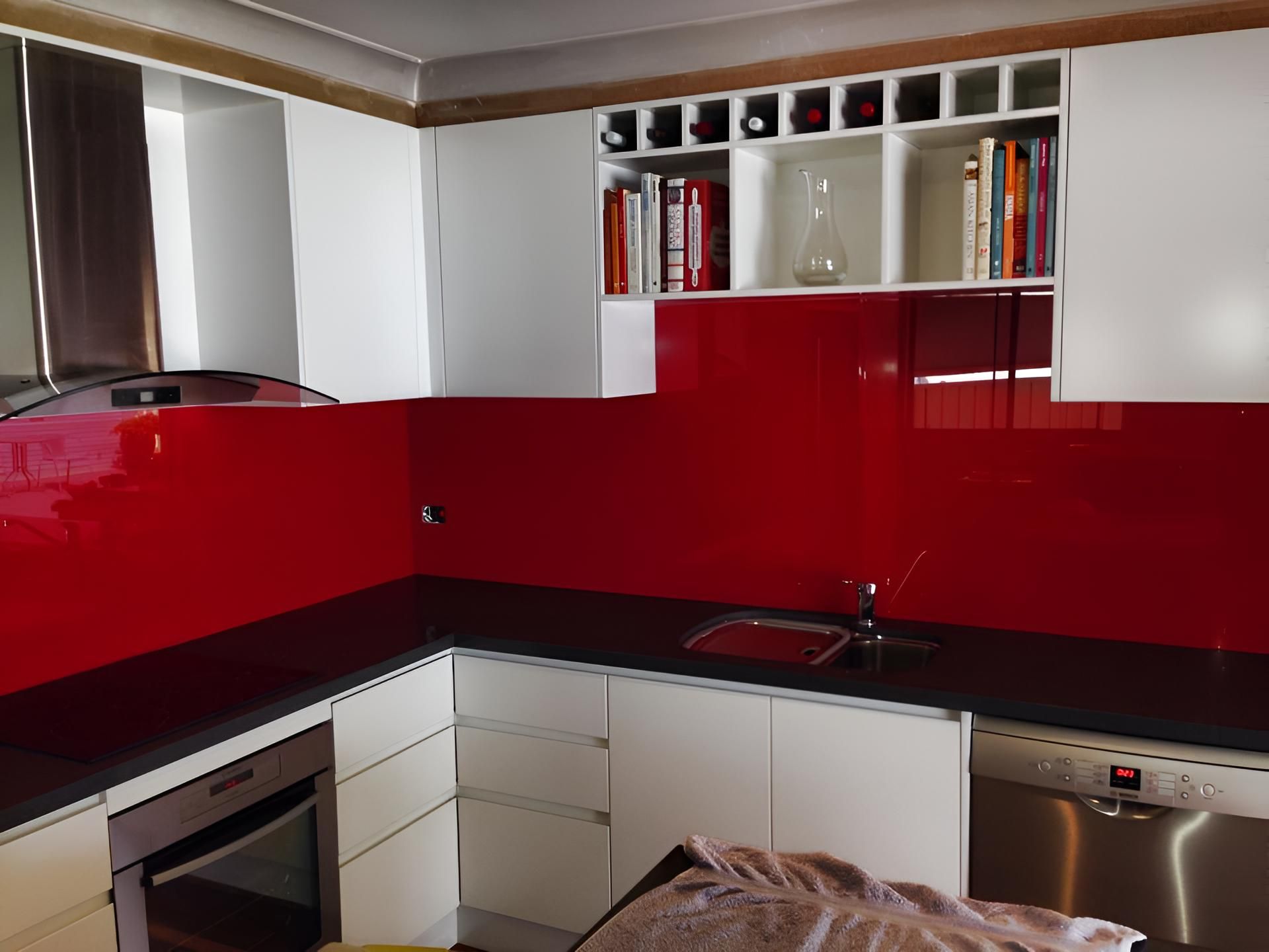 A Kitchen With A Red Backsplash And White Cabinets — Pavy's Glass In Port Macquarie, NSW