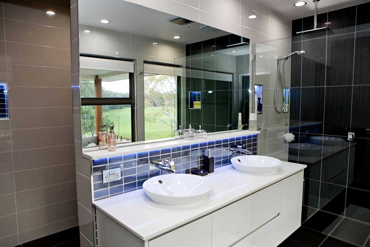 A Bathroom With Two Sinks And A Large Mirror — Pavy's Glass In Port Macquarie, NSW
