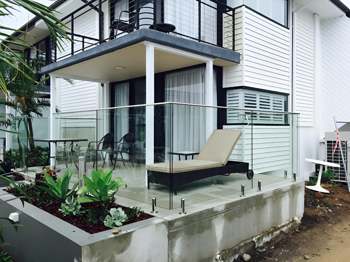 A Large White House With A Glass Railing — Pavy's Glass In Port Macquarie, NSW