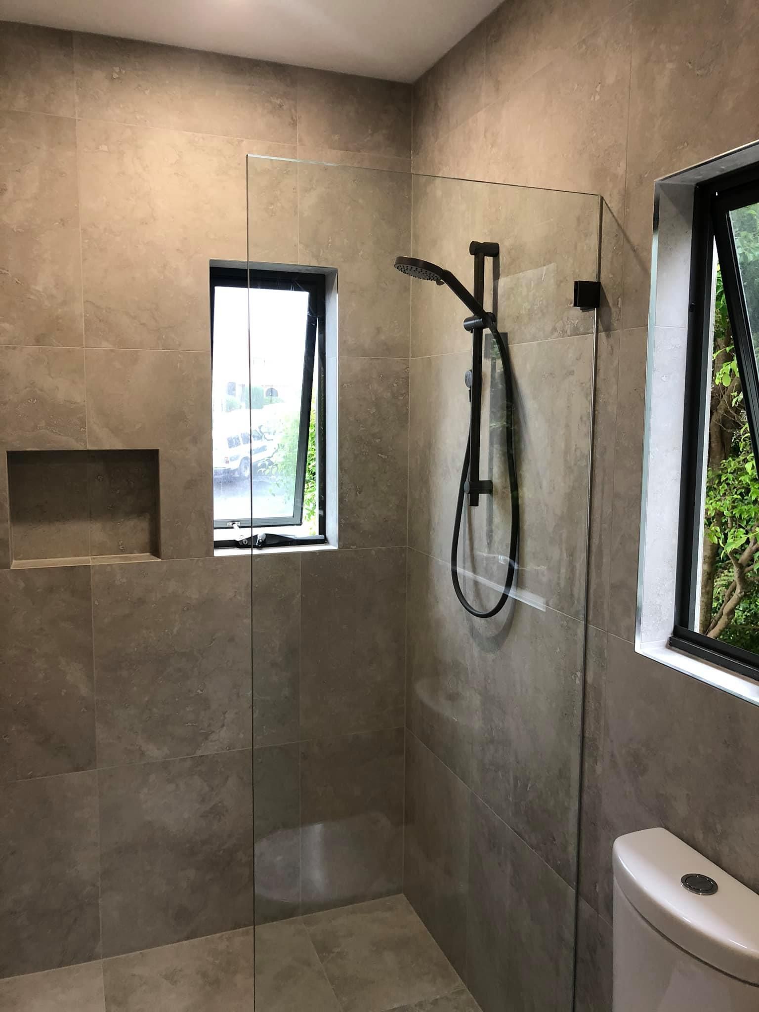 A Bathroom With A Walk In Shower And A Toilet — Pavy's Glass In Port Macquarie, NSW