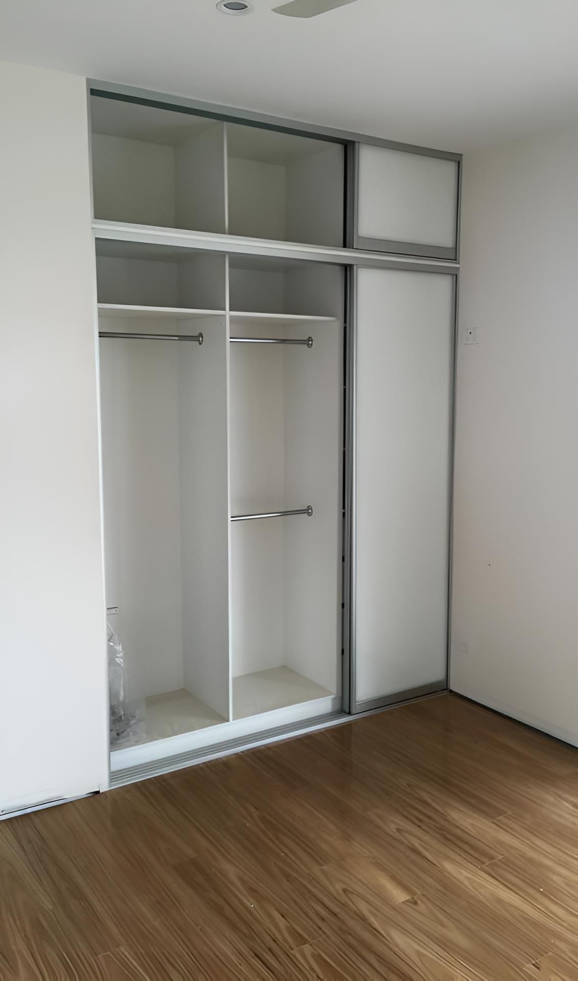 An Empty Room With A Sliding Door Wardrobe — Pavy's Glass In Port Macquarie, NSW