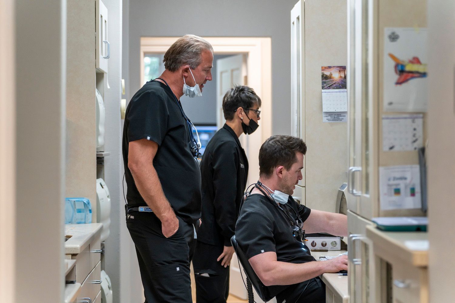 Dr. Maley, Dr. Crawford, and a dental hygienist are all working together at Maley Family Dental