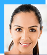 A close up of a woman 's face smiling.