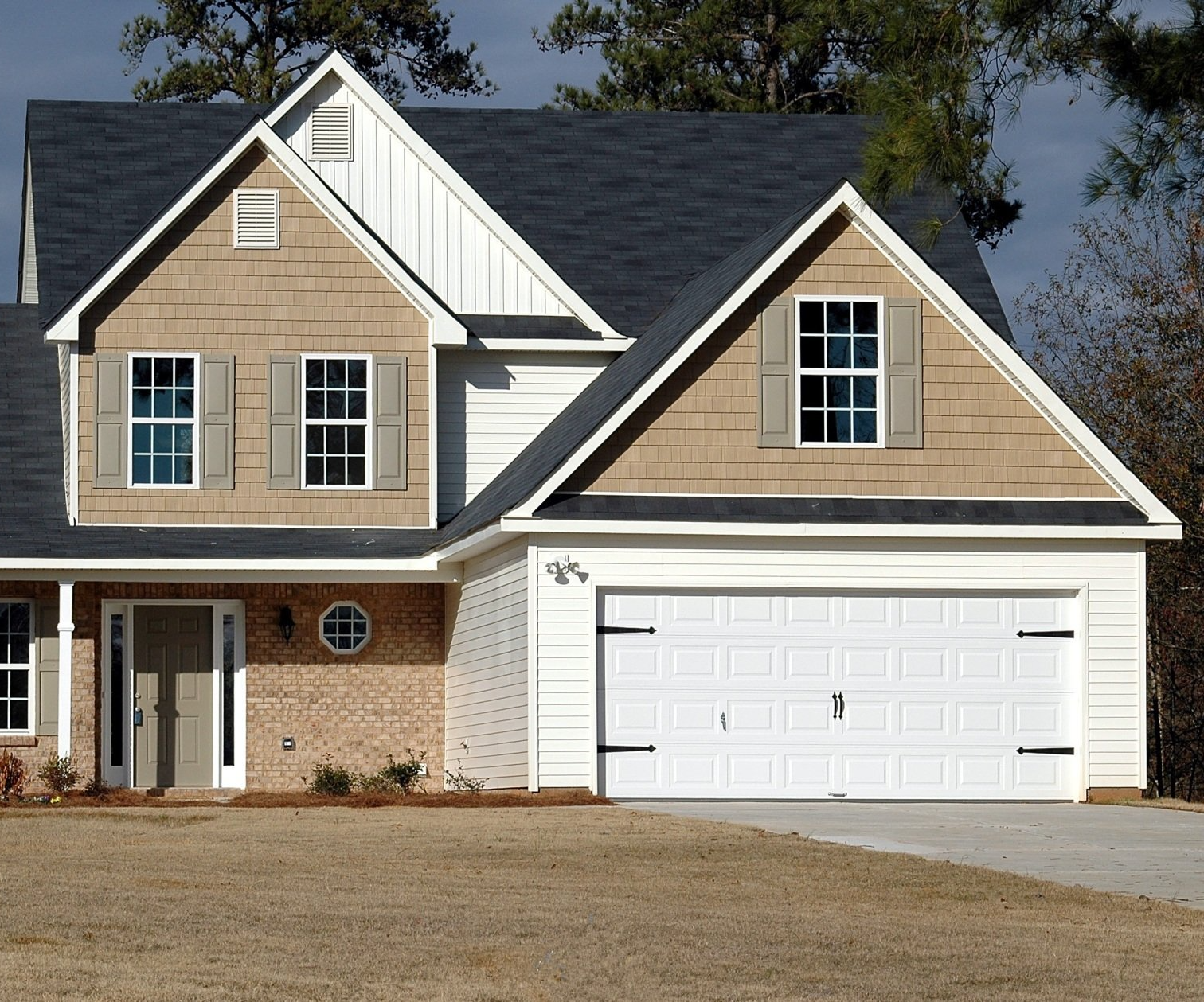 House with wide white garage door